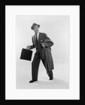 1950s Surprised Businessman Holding Briefcase Taking A Step Forward Looking Back by Anonymous