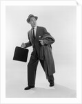 1950s Surprised Businessman Holding Briefcase Taking A Step Forward Looking Back by Anonymous