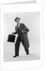 1950s Surprised Businessman Holding Briefcase Taking A Step Forward Looking Back by Anonymous