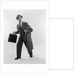 1950s Surprised Businessman Holding Briefcase Taking A Step Forward Looking Back by Anonymous