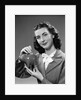 1940s Woman Putting Change Into Piggy Bank by Anonymous
