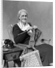 1930s Elderly Woman Wearing Pince-Nez Glasses Sitting Knitting by Anonymous