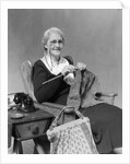 1930s Elderly Woman Wearing Pince-Nez Glasses Sitting Knitting by Anonymous