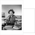 1950s 1960s College Woman Studying Surrounded All Around By Piles Of Books by Anonymous