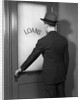 1930s 1940s Man In Suit And Hat Opening Door Marked Loans by Anonymous