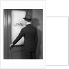 1930s 1940s Man In Suit And Hat Opening Door Marked Loans by Anonymous