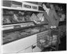 1950s Woman Shopping Frozen Food Section Of Grocery Store by Anonymous