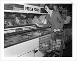 1950s Woman Shopping Frozen Food Section Of Grocery Store by Anonymous