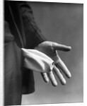 1930s Man's Hand Turning Empty Pants Pocket Inside Out by Anonymous