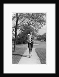 1950s Woman Walking On Sidewalk Carrying A Grocery Bag Full Of Food by Anonymous