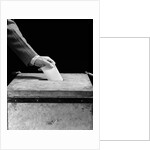 1930s 1940s Man's Hand Putting Ballot In Slot In Box by Anonymous