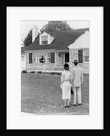 1940s 1950s Couple Standing Outside Looking At Stone Suburban House by Anonymous