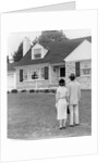 1940s 1950s Couple Standing Outside Looking At Stone Suburban House by Anonymous