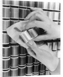 1940s Hand Woman Matching Spool Of Thread To Swatch Of Material by Anonymous
