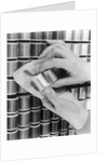 1940s Hand Woman Matching Spool Of Thread To Swatch Of Material by Anonymous