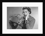 1950s Woman With Exaggerated Expression Hand On Face Looking Inside Her Purse by Anonymous