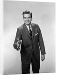 1960s Salesman Or Businessman Leaning Forward Extending Hand For Handshake by Anonymous