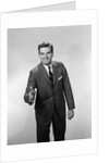 1960s Salesman Or Businessman Leaning Forward Extending Hand For Handshake by Anonymous