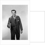 1960s Salesman Or Businessman Leaning Forward Extending Hand For Handshake by Anonymous