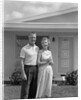 1950s Older Man Woman Senior Citizen Standing Together In Retirement Home Front Yard by Anonymous