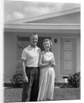 1950s Older Man Woman Senior Citizen Standing Together In Retirement Home Front Yard by Anonymous