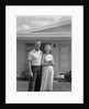 1950s Older Man Woman Senior Citizen Standing Together In Retirement Home Front Yard by Anonymous