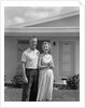 1950s Older Man Woman Senior Citizen Standing Together In Retirement Home Front Yard by Anonymous