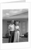 1950s Older Man Woman Senior Citizen Standing Together In Retirement Home Front Yard by Anonymous