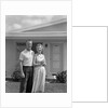 1950s Older Man Woman Senior Citizen Standing Together In Retirement Home Front Yard by Anonymous