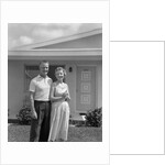 1950s Older Man Woman Senior Citizen Standing Together In Retirement Home Front Yard by Anonymous