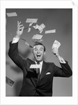 1960s Happy Man Throwing Money Currency Bank Notes In The Air by Anonymous