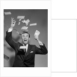1960s Happy Man Throwing Money Currency Bank Notes In The Air by Anonymous