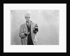 1930s Dour Man In Lab Coat Holding Bottle Of Poison by Anonymous