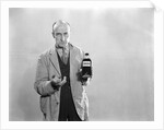 1930s Dour Man In Lab Coat Holding Bottle Of Poison by Anonymous