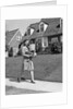 1940s Woman Walking Shopping Carrying Grocery Bag On Suburban House Sidewalk by Anonymous