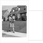 1940s Woman Walking Shopping Carrying Grocery Bag On Suburban House Sidewalk by Anonymous