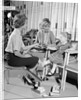 1960s Mother Daughter Shoe Shopping Saleswoman Showing Patent Leather Shoe To Girl by Anonymous