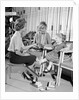 1960s Mother Daughter Shoe Shopping Saleswoman Showing Patent Leather Shoe To Girl by Anonymous