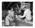1960s Mother Daughter Unload Grocery Cart At Supermarket Checkout Counter by Anonymous