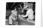 1960s Mother Daughter Unload Grocery Cart At Supermarket Checkout Counter by Anonymous