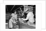 1960s Mother Daughter Unload Grocery Cart At Supermarket Checkout Counter by Anonymous
