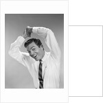 1960s Businessman In Shirtsleeves Clasping Hands Together Overhead by Anonymous