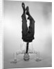 1960s Man In Shirt and Tie Standing On Head by Anonymous