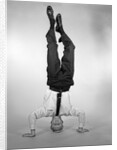 1960s Man In Shirt and Tie Standing On Head by Anonymous