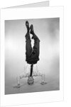 1960s Man In Shirt and Tie Standing On Head by Anonymous