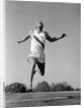 1960s Man Running Winning Sprinting Across The Finish Line Outdoor by Anonymous