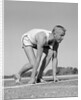 1960s Man Sprinter Runner At The Starting Line For Foot Race Outdoor by Anonymous