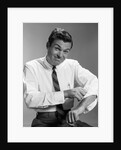 1960s Man In Business Shirt And Tie Rolling Up His Sleeves To Work Determined Look Studio by Anonymous
