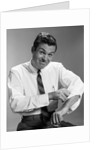 1960s Man In Business Shirt And Tie Rolling Up His Sleeves To Work Determined Look Studio by Anonymous