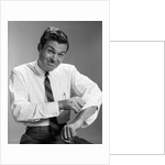 1960s Man In Business Shirt And Tie Rolling Up His Sleeves To Work Determined Look Studio by Anonymous